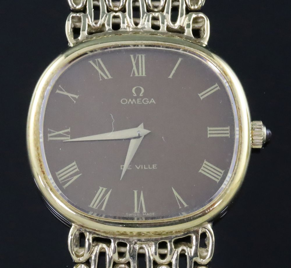 A gentlemans 1970s silver gilt Omega de Ville manual wind wristwatch, on Omega oval link bracelet,